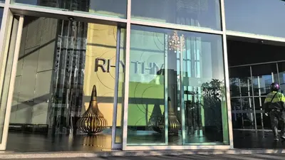 a store window with a reflection of a rocket in it at MSHomeStay 5388 in Bangkok