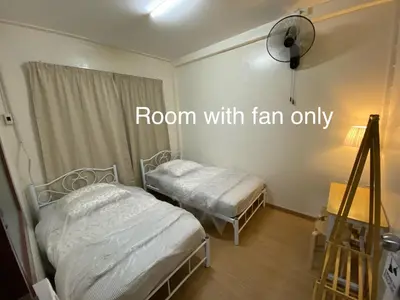 two beds in a room with a room with fan only at PAMA'Pranakorn in Bangkok
