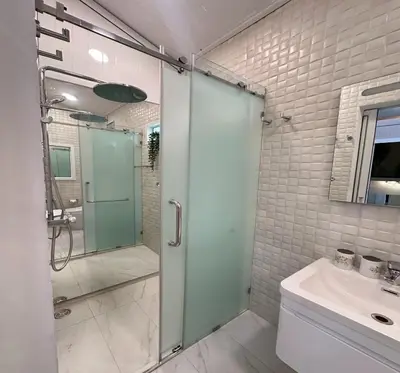 a bathroom with a shower and a sink at Residence at 49 in Bangkok