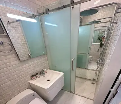 a bathroom with a toilet and a sink and a shower at Residence at 49 in Bangkok