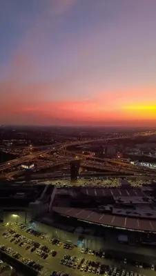 an aerial view of a parking lot at sunset at Plum New West - Pool View in Ban Bang Krabu