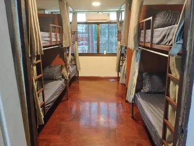 a room with a bunch of bunk beds at The Green Bean Hostel Khaosan in Bangkok