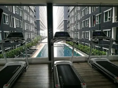 a gym in a building with a swimming pool at Panoramic sky city view 1 BR at MRT Bangson By Orn in Bangkok