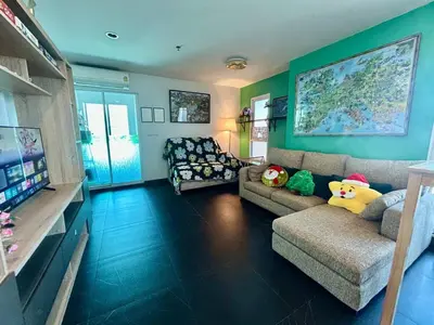 a living room with a couch and a tv at Panoramic sky city view 1 BR at MRT Bangson By Orn in Bangkok