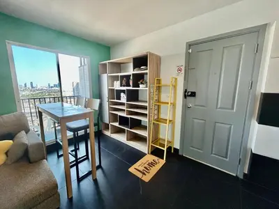a room with a table and a door with a view at Panoramic sky city view 1 BR at MRT Bangson By Orn in Bangkok