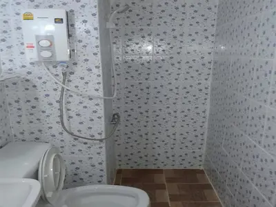 a bathroom with a shower and a toilet at Smart Residence@Muengthongthani in Nonthaburi