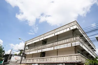 a building with white balconies against a blue sky at ดอนเมือง 203 Near DMK Airport BTS Wat PhraSi in Bang Khen