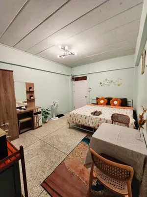 a bedroom with a bed and a table in it at 707-STP Homely room Free Wi-Fi and Near BTS in Sathani Bang Khen