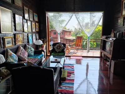a living room with a couch and a table at นำสมัย สุขใจ สนามชัย in Bangkok