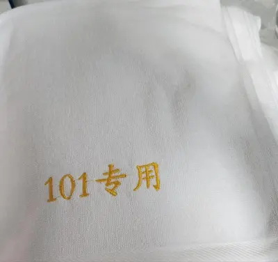 a white shirt with chinese writing on it at 101Hotel in Ban Na Song