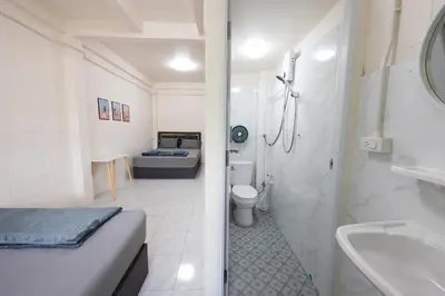 a bathroom with a bed and a toilet and a sink at ดอนเมือง 302 Near DMK Airport BTS Wat PhraSi in Bang Khen