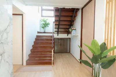 a staircase in a room with a stair case at Stay Ekkamai - Private Pool villa, Central Bangkok in Bangkok