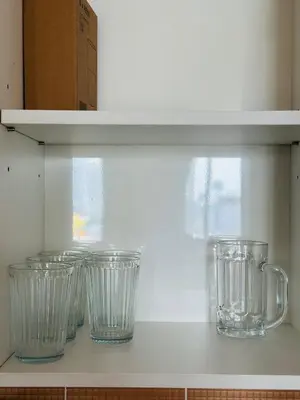 a row of glass vases sitting on a shelf at Page65-Bangkok Urban Light & City Rhythm -Ekkamai in Bangkok