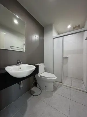 a bathroom with a sink and a toilet and a shower at Pano Ratchada 19 BKK MRT in Bangkok