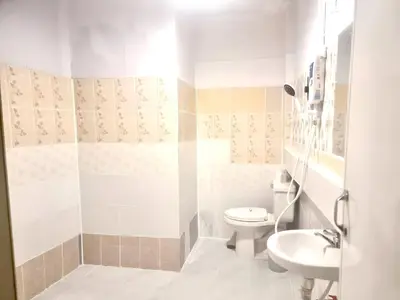 a bathroom with a toilet and a sink at Znap Yaowarat - MRT Wat Mangkon in Samphanthawong