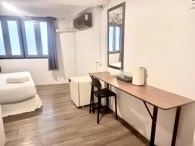 a small room with a desk and a bed at Znap Yaowarat - MRT Wat Mangkon in Samphanthawong