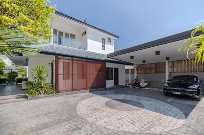 a car parked in the driveway of a house at Thong Lo Private Pool Villa In Center Of Bangkok in Bangkok