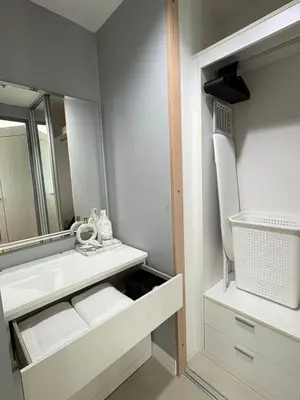 a bathroom with a sink and a mirror at Ideo Mix Sukhumvit 103, right next to BTS Udomsuk in Phra Khanong