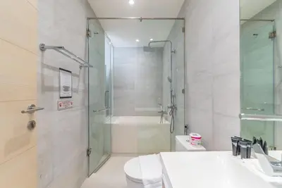 a bathroom with a shower and a toilet and a sink at Heart \u7d20\u5764\u903836 Chewaheart Sukhumvit 36 in Bangkok