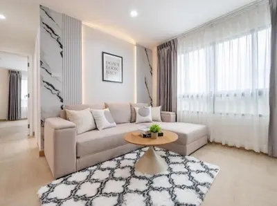 a living room with a couch and a table at Cozy style 2BR 2B near street food in city in Bangkok