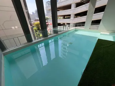 a swimming pool in the middle of a building at Luxury Villa 4BR - 8 Mins to Thonglor BTS in Bangkok