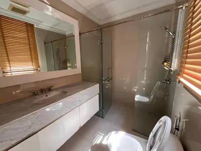 a bathroom with a shower and a toilet and a sink at Luxury Villa 4BR - 8 Mins to Thonglor BTS in Bangkok