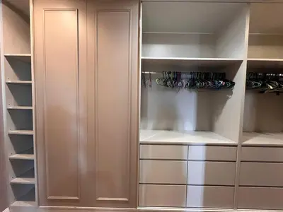 a closet with white cabinets and racks of wine glasses at Luxury Villa 4BR - 8 Mins to Thonglor BTS in Bangkok