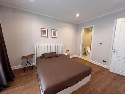 a bedroom with a large bed in a room at Luxury private swimming pool house for 10pax in Bangkok