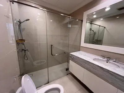 a bathroom with a shower and a toilet and a sink at Luxury private swimming pool house for 10pax in Bangkok