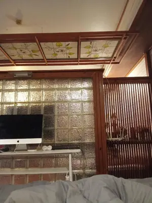 a room with a window with a computer on a desk at Spacious City-View Apartment with Modern Amenities in Krung Thep in Amphoe Phra Khanong