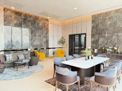 a dining room with a table and chairs at Bangkok Rama9 Cassia & Siamese in Bangkok
