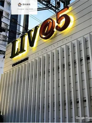 a large sign on the side of a building at Designer Home BTS bangkok centre Pool Gym