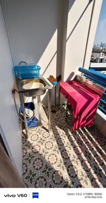 a balcony with a table and chairs on a ship at Mansion phram6 B in Bangkok