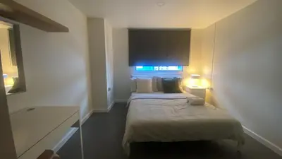 a hotel room with two beds and a window at Sawasdee Bangkok Condo Modern 2BR BTS Srinakarin38 connect Sukhumvit Route 20mins Aiport and 15mins Sukhumvit Line in Bangna