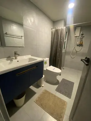 a bathroom with a sink and a toilet at Sawasdee Bangkok Condo Modern 2BR BTS Srinakarin38 connect Sukhumvit Route 20mins Aiport and 15mins Sukhumvit Line in Bangna