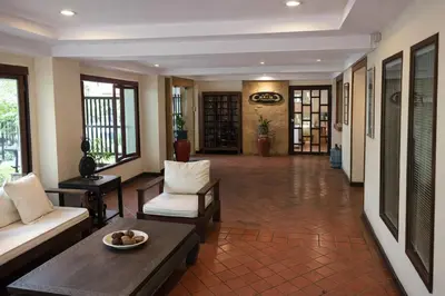 a living room with a couch and a table at Big 3 bedroom apartment Asoke in Bangkok