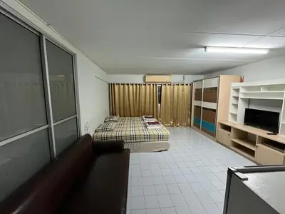 a room with a bed and a couch in it at Impact Arena C3 by Jintana in Ban Bang Phang