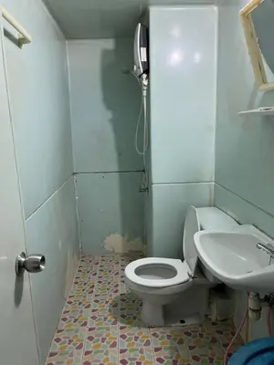 a bathroom with a toilet and a sink at Impact Arena C3 by Jintana in Ban Bang Phang