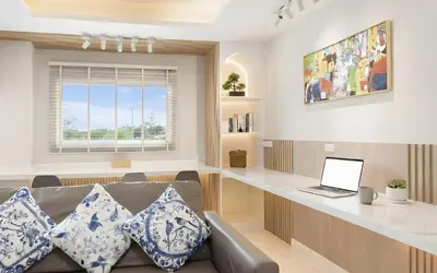 a living room with a couch and a desk with a laptop at Bangkoks most beautiful modern villa centre in Bangkok