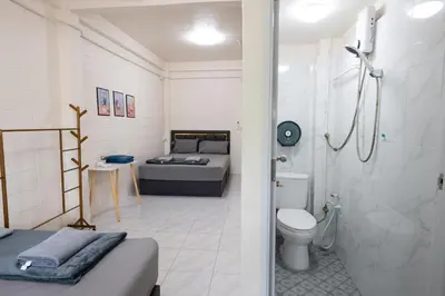 a bathroom with a bed and a shower and a toilet at ดอนเมือง 303 Near DMK Airport BTS Wat PhraSi in Bang Khen