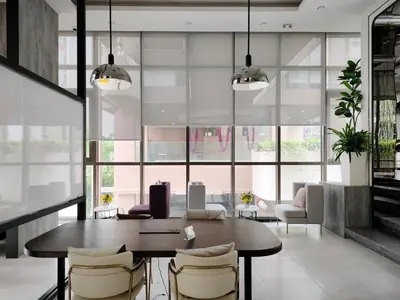 a dining room with a table and chairs at Phahonyothin 35 Cozy 1BR Near BTS Chatuchak in Sathani Bang Khen