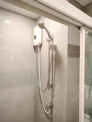a shower with a shower head in a bathroom at Phahonyothin 35 Cozy 1BR Near BTS Chatuchak in Sathani Bang Khen