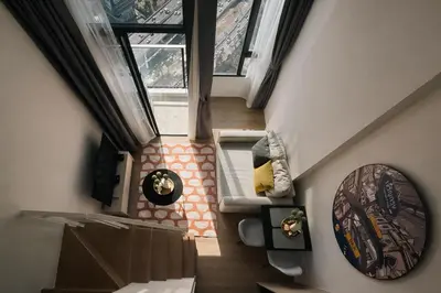 an overhead view of a living room in a house at High-Ceiling Loft Suite Rama 9 Design Apartment in Bangkok