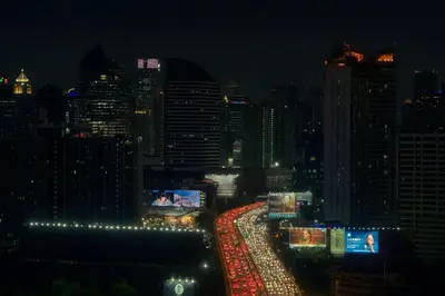 a view of a city at night with lights at High-Ceiling Loft Suite Rama 9 Design Apartment in Bangkok