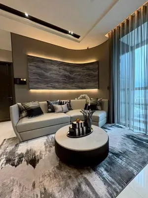 a living room with a couch and a table at The Bangkok Thonglor in Bangkok