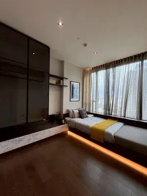a bedroom with two beds and a large window at The Bangkok Thonglor in Bangkok