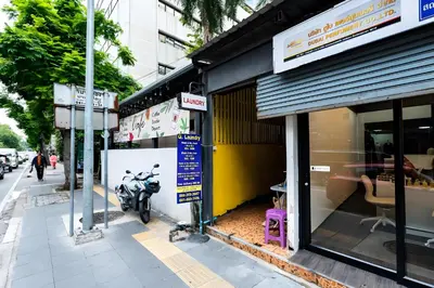 a motorcycle parked outside of a store on a street at XX Oh My Nap Sukhumvit 3 - นานาเหนือ in Makkasan