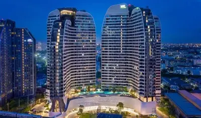 a view of a large building in a city at night at Idea Labs Luxury Condo Coworking spaces in Ban Khlong Samrong