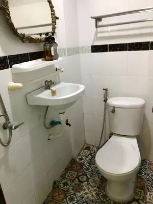 a bathroom with a toilet and a sink at Oh My Nap Sukhumvit Soi 3 - คลองเตยเหนือ in Makkasan
