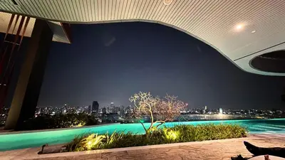 a view of a city at night from a building at Lovely home 2 in Ban Na Song